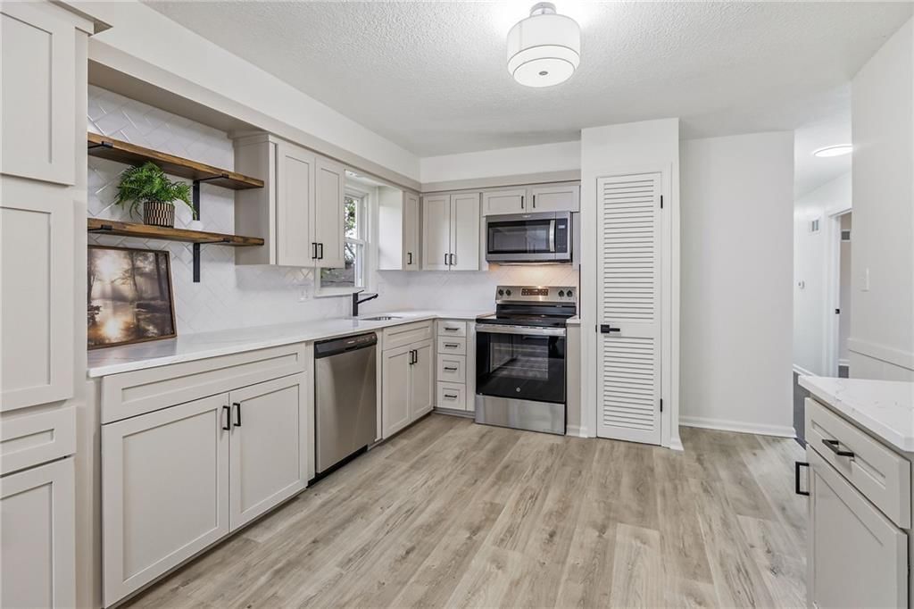 Updated kitchen and kitchen backsplash at 5008 Spring Street, Kansas City, MO 64133
