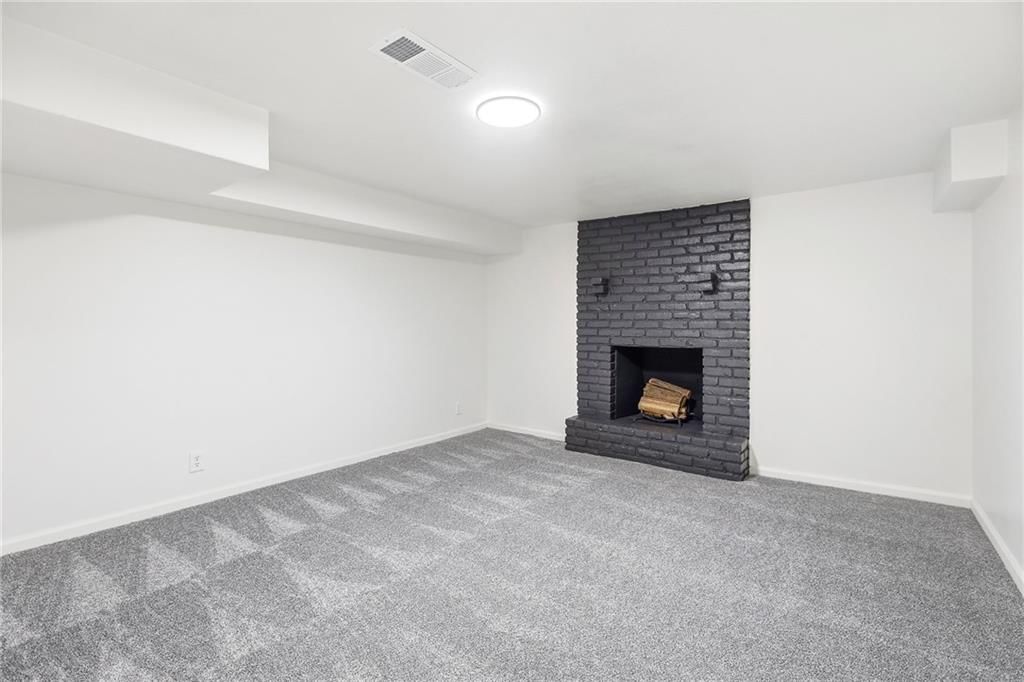 Finished basement and staircase at 5008 Spring Street, Kansas City, MO 64133