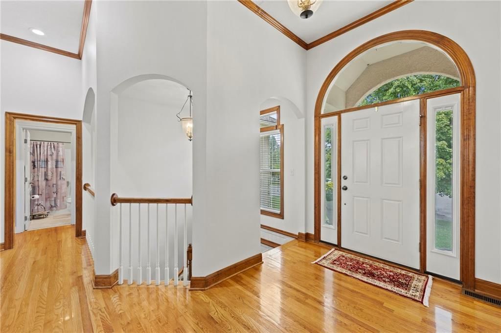 Hardwood floors and white trim at 29483 Masters Court, Louisburg, KS 66053