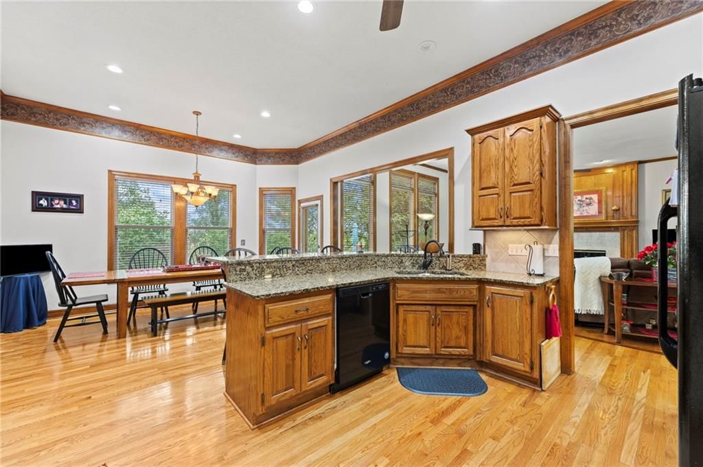 Open floor plan and kitchen island at 29483 Masters Court, Louisburg, KS 66053