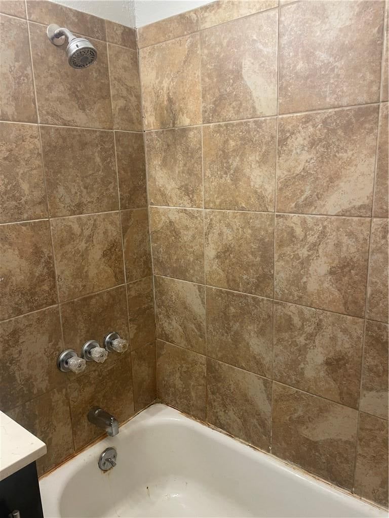 Tiled shower at 2107 E 77th Terrace, Kansas City, MO 64132