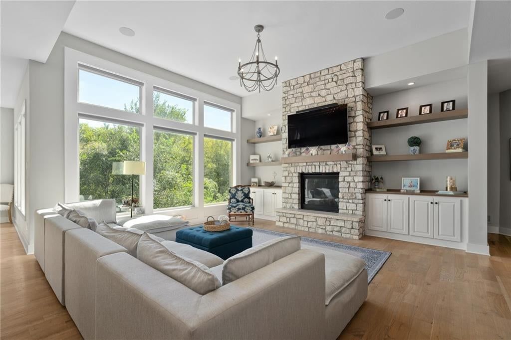 Fireplace and stone fireplace at 2181 W 89th Place, Leawood, KS 66206