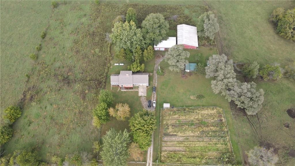 Big backyard and mature trees at 9700 W 319th Street, Louisburg, KS 66053