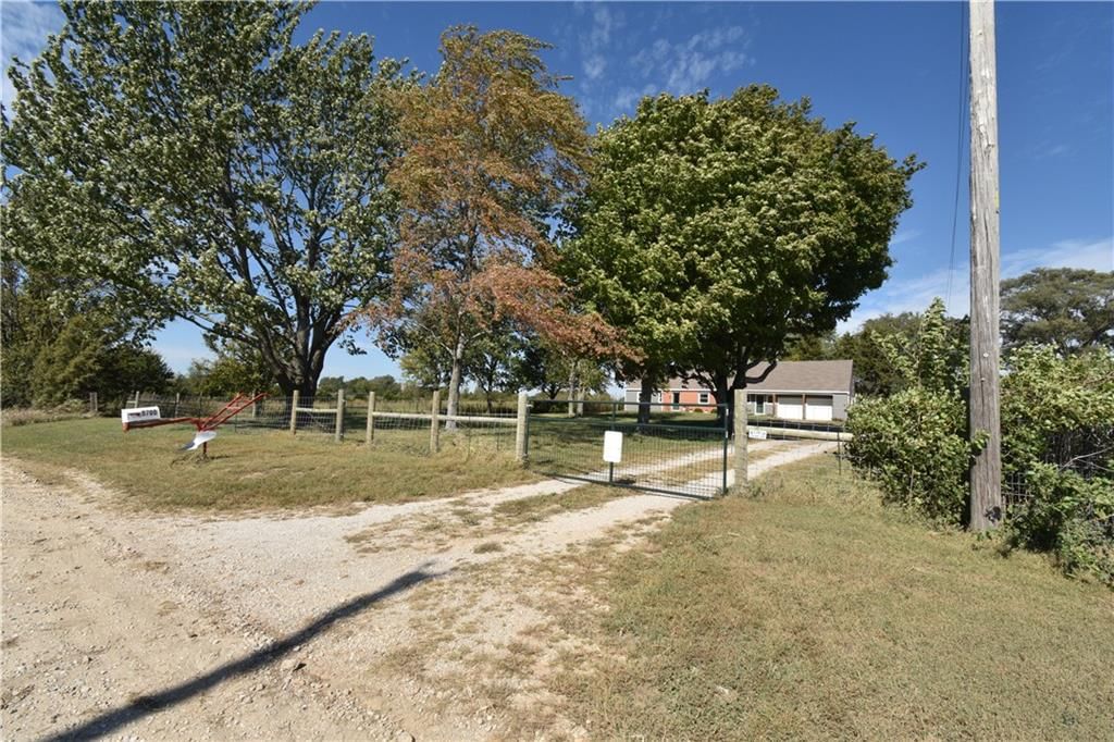 Gated driveway and fenced yard at 9700 W 319th Street, Louisburg, KS 66053