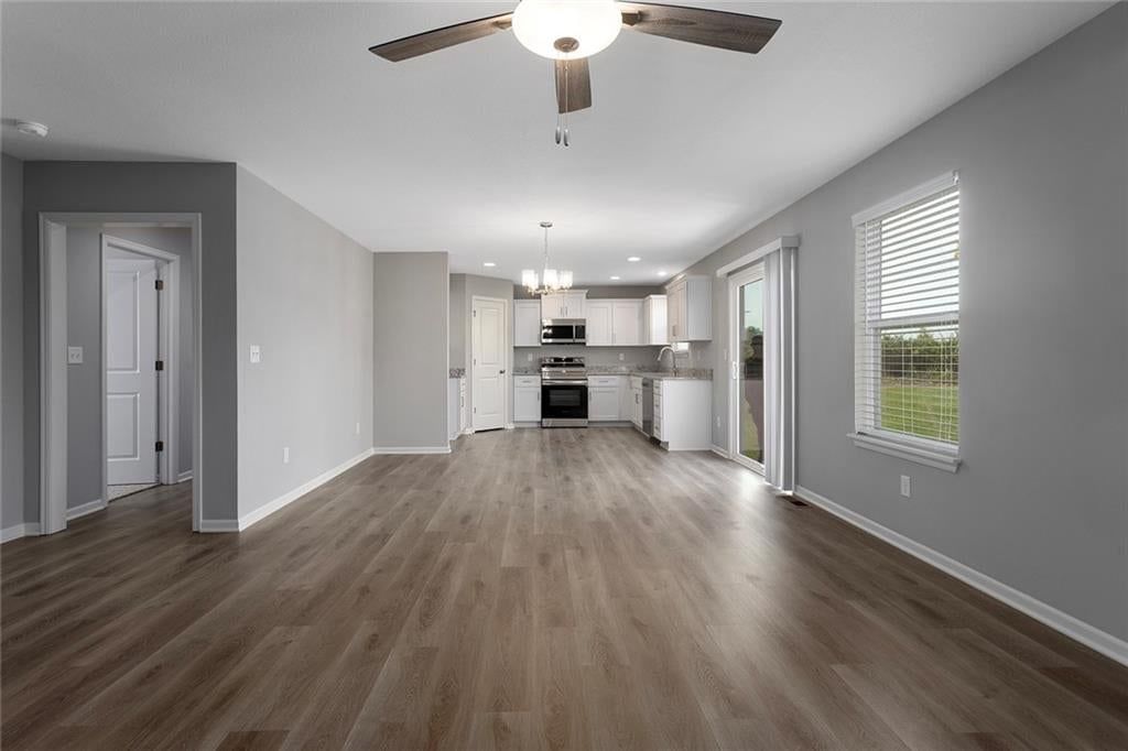 Open floor plan, breakfast nook and recessed lighting at 523 Lemon Mint Drive, Raymore, MO 64083