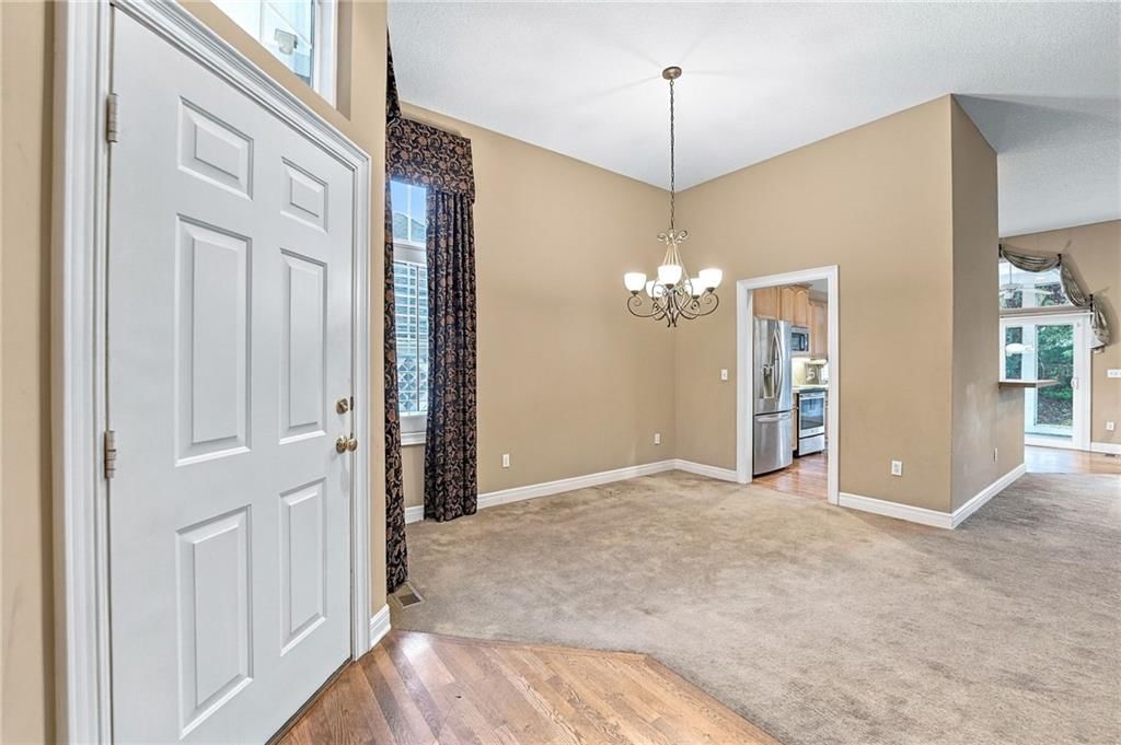 Tall ceilings, open floor plan and hardwood floors at 13408 Summit Court, Kansas City, MO 64145