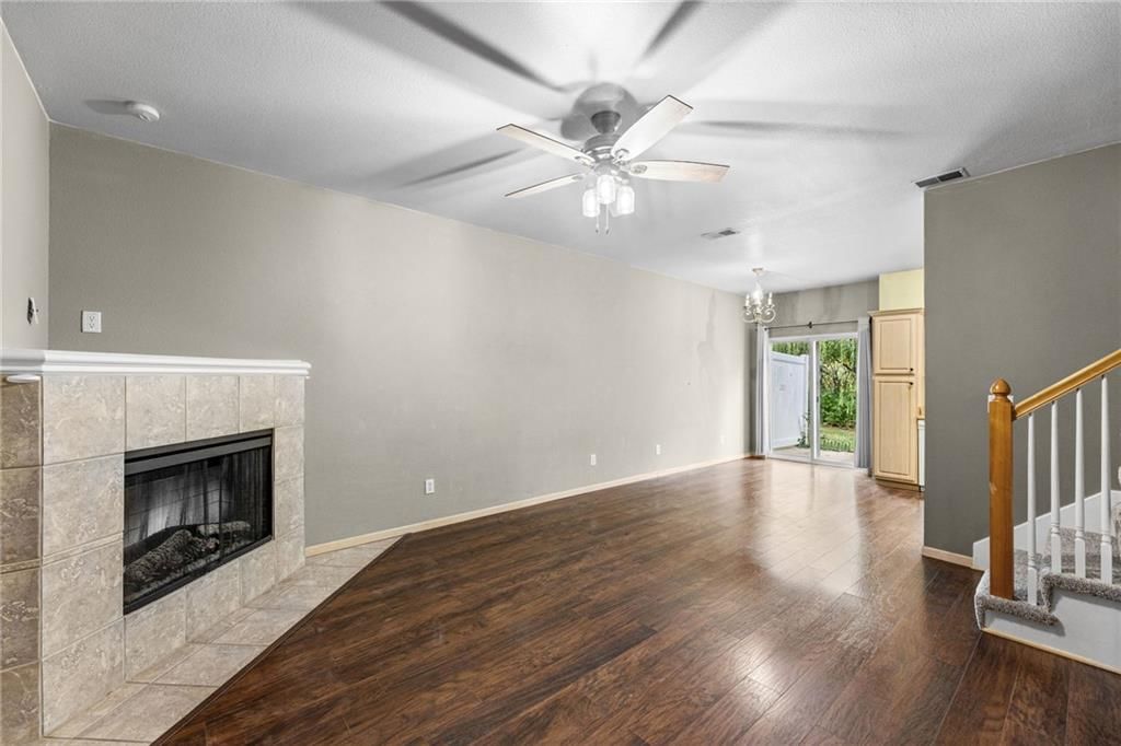 Fireplace, open floor plan and hardwood floors at 1623 SW Mission Road, Lee's Summit, MO 64081