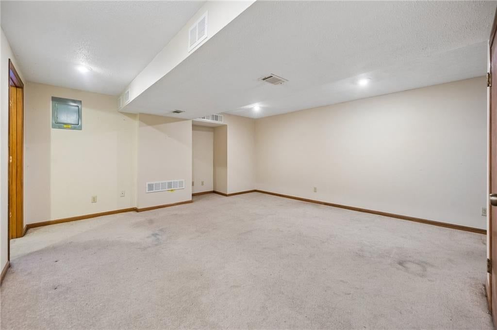 Finished basement and staircase at 6906 N CHAS Drive, Pleasant Valley, MO 64068