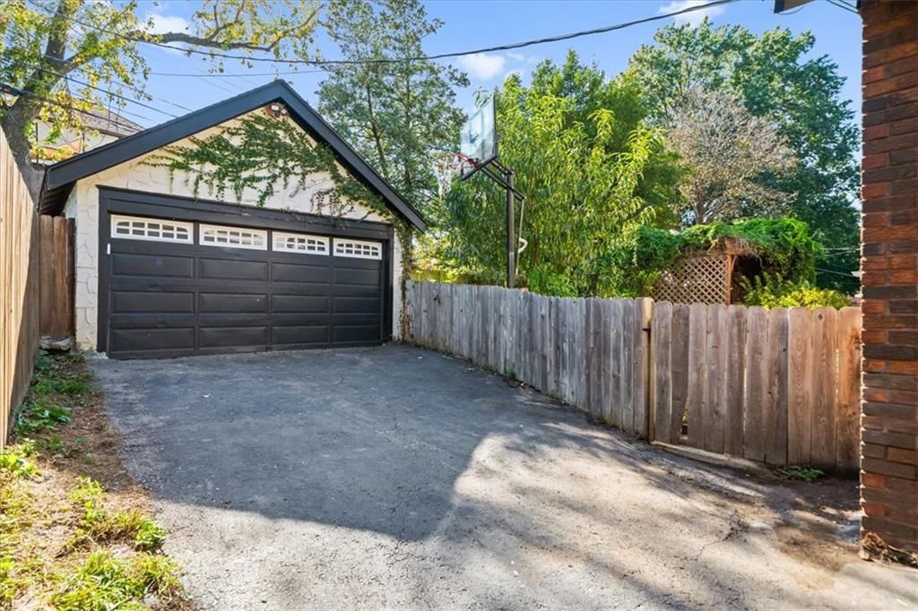 Fenced yard and basketball hoop at 211 E 66TH Street, Kansas City, MO 64113