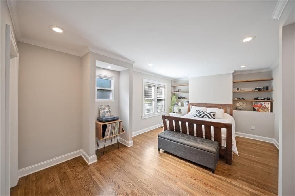 Main-floor primary bedroom at 211 E 66TH Street, Kansas City, MO 64113