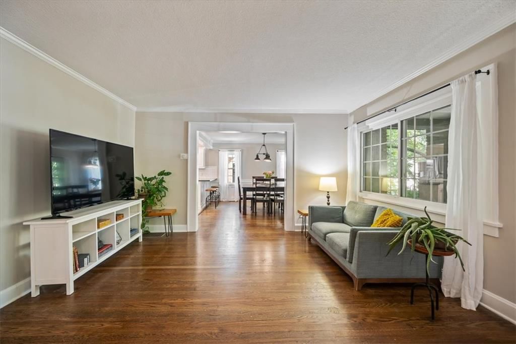 Hardwood floors, recessed lighting and white trim at 211 E 66TH Street, Kansas City, MO 64113