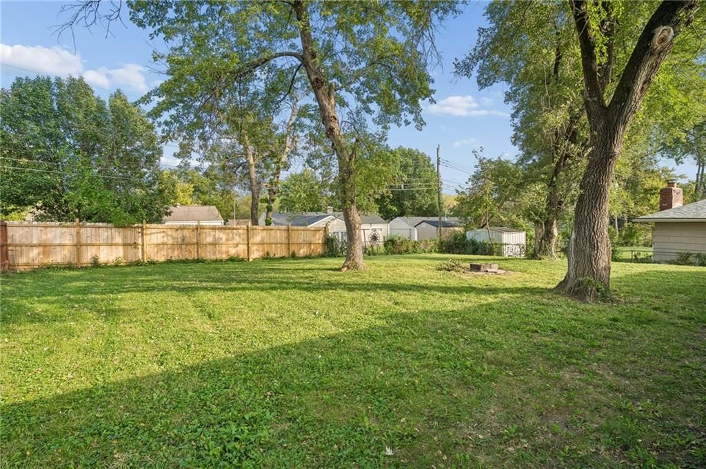 Big backyard, fenced yard and mature trees at 11305 Mckinley Avenue, Kansas City, MO 64134
