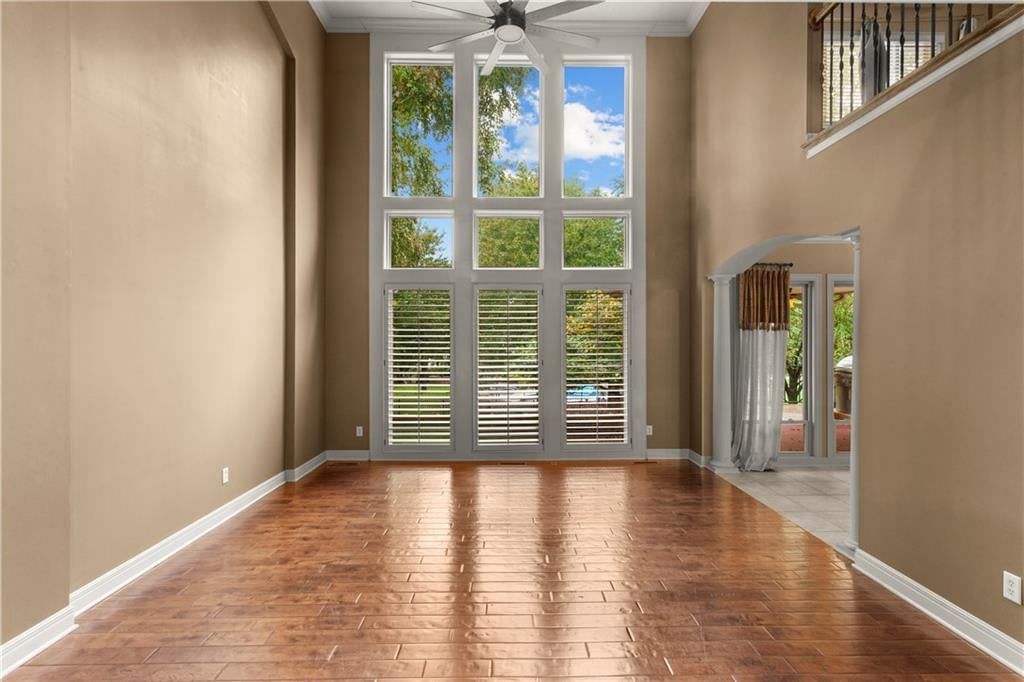 Tall ceilings, open floor plan and floor-to-ceiling windows at 205 SW LEWIS Court, Lee's Summit, MO 64081