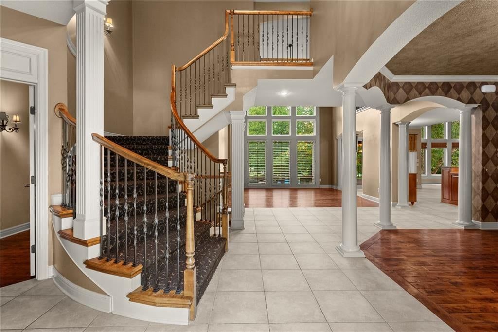 Staircase and iron stair railing at 205 SW LEWIS Court, Lee's Summit, MO 64081