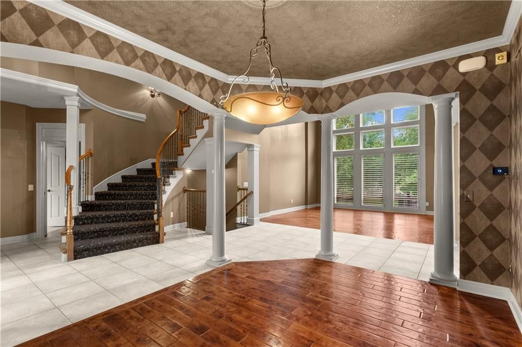 Hardwood floors, statement lighting and tile floors at 205 SW LEWIS Court, Lee's Summit, MO 64081