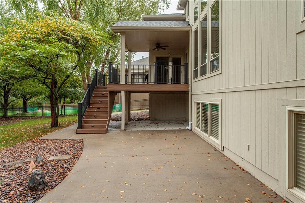 Deck, big backyard and fenced yard at 205 SW LEWIS Court, Lee's Summit, MO 64081