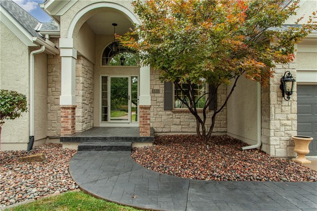 Covered front porch at 205 SW LEWIS Court, Lee's Summit, MO 64081