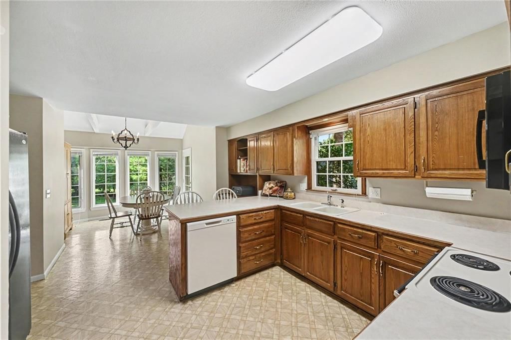 Kitchen island and white countertops at 2305 W 120th Terrace, Leawood, KS 66209