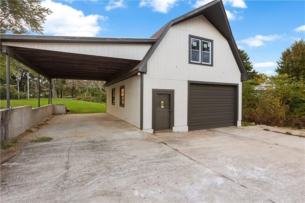 Covered patio and concrete patio at 2712 S Sante Fe Road, Independence, MO 64052