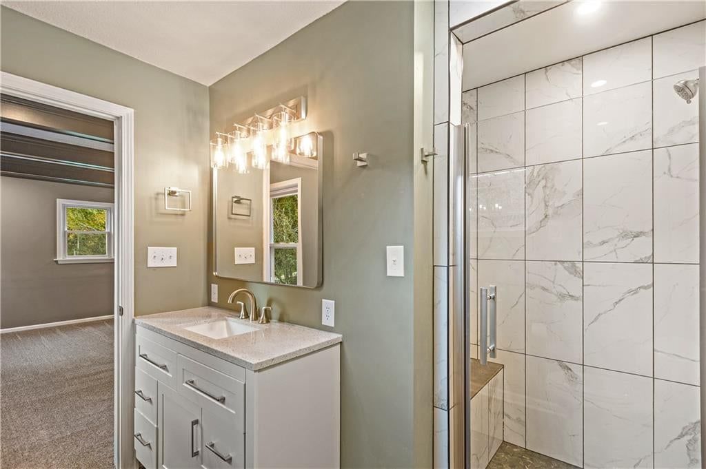 Walk-in shower, tiled shower and frameless glass shower at 2712 S Sante Fe Road, Independence, MO 64052