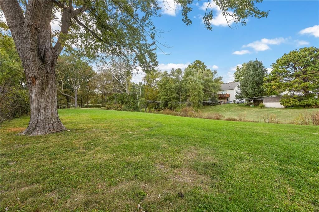 Big backyard, mature trees and flat lot at 2712 S Sante Fe Road, Independence, MO 64052