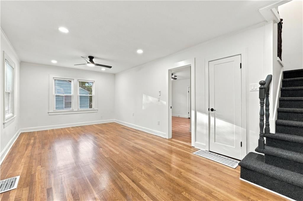Hardwood floors, recessed lighting and black hardware at 9358 E 64th Terrace, Raytown, MO 64133