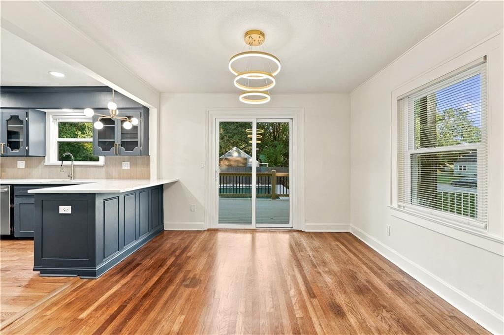 Open floor plan, statement lighting and breakfast nook at 9358 E 64th Terrace, Raytown, MO 64133