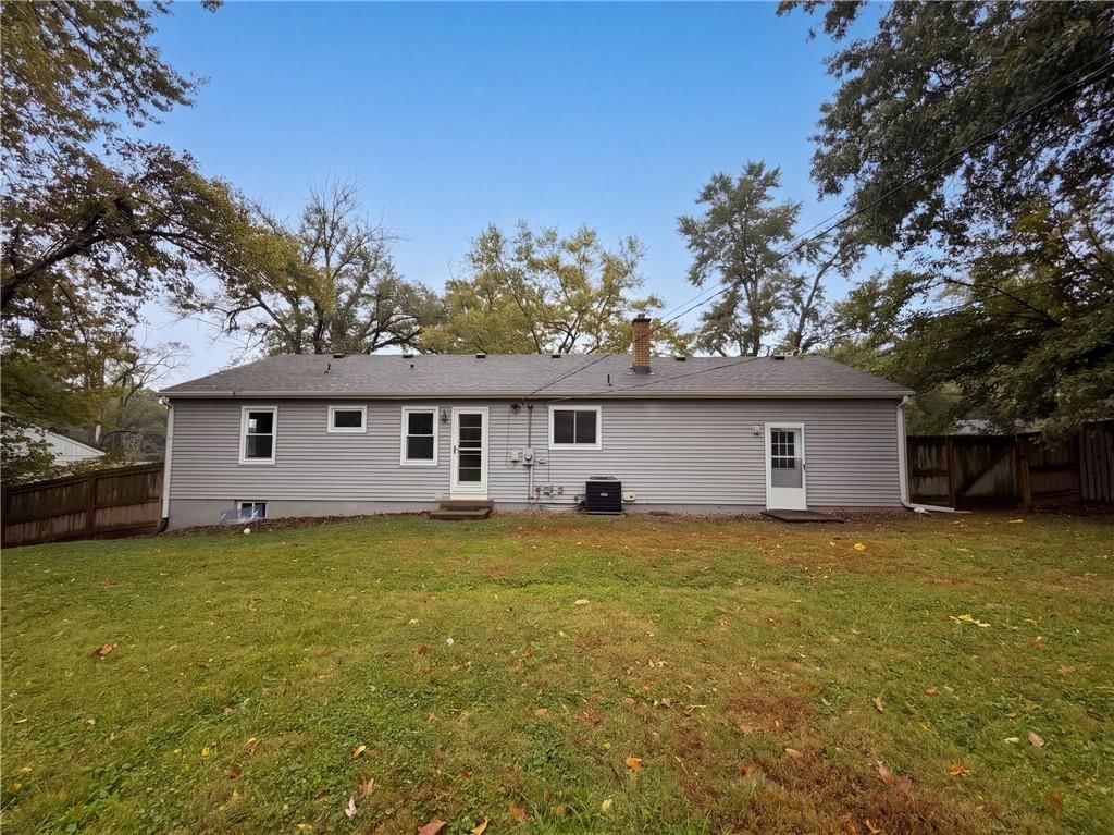 Big backyard, fenced yard and wood fence at 11214 E 48th Street, Kansas City, MO 64133