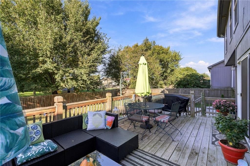 Deck, big backyard and fenced yard at 372 W Madison Street, Gardner, KS 66030
