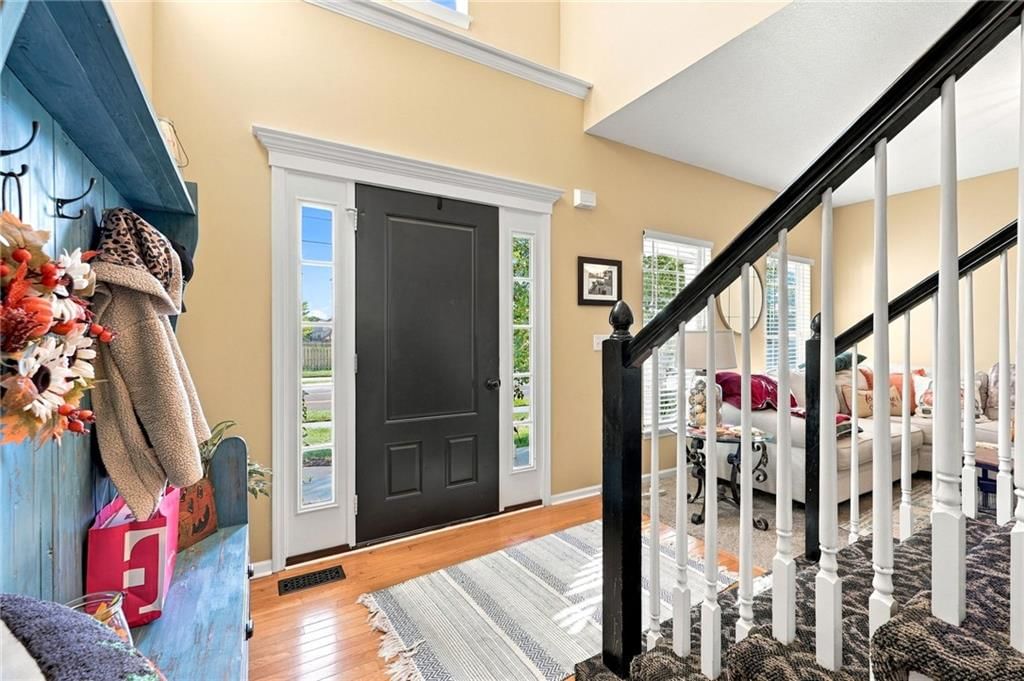 Staircase, mixed stair railing and white trim at 372 W Madison Street, Gardner, KS 66030
