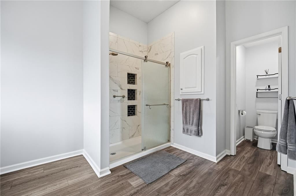 Walk-in shower, private toilet room and tiled shower at 2252 SW Morris Drive, Lee's Summit, MO 64082