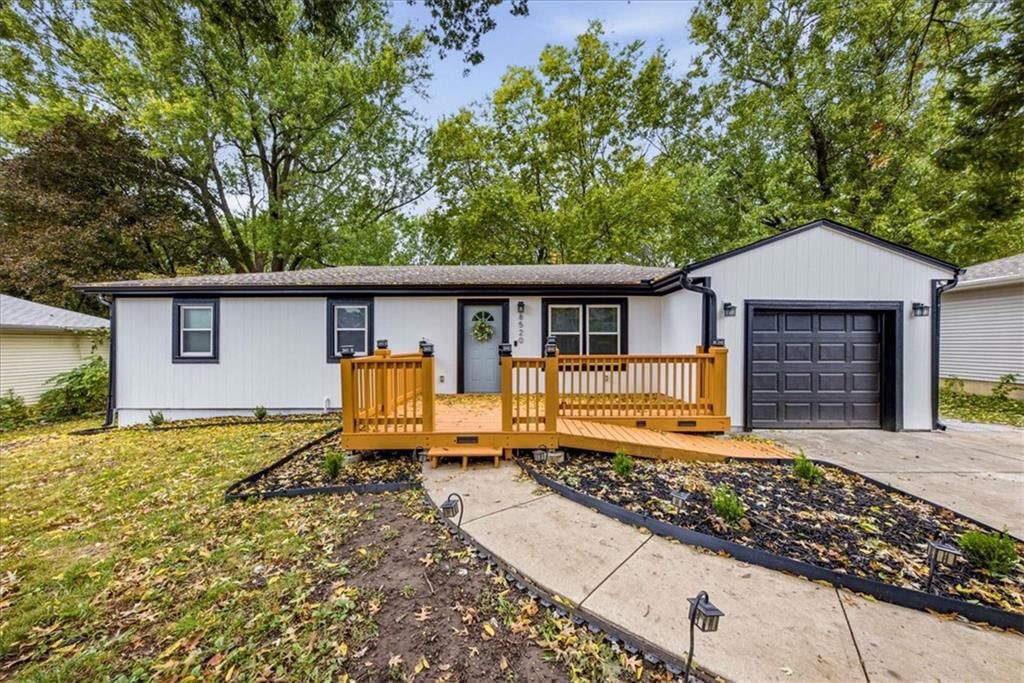 Black exterior windows and attached garage at 8520 Larsen Street, Overland Park, KS 66214