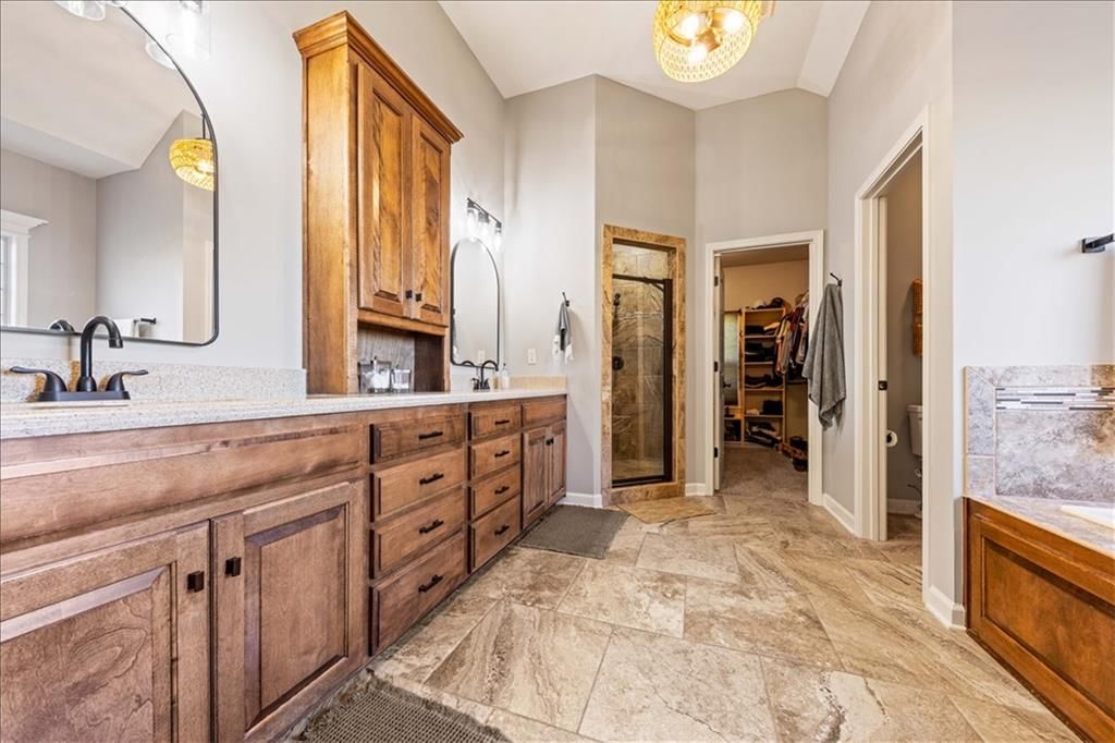 Tile floors, walk-in shower and tiled shower at 15096 NW 66th Street, Parkville, MO 64152