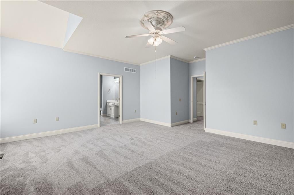 Main-floor primary bedroom at 14561 Birch Street #22, Leawood, KS 66224