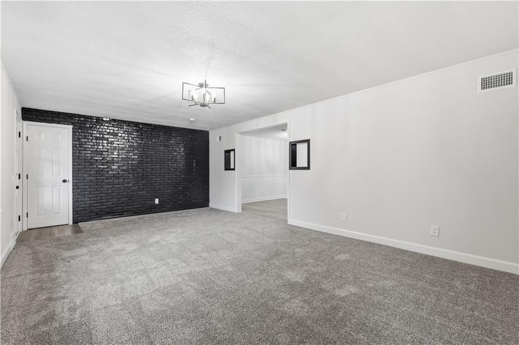 Exposed brick wall and accent wall at 702 SW Locust Street, Oak Grove, MO 64075