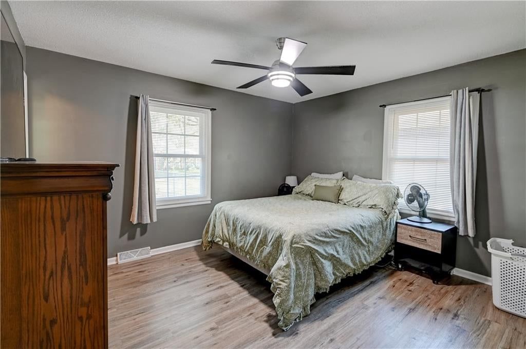 Main-floor primary bedroom at 213 Johnson Street, Buckner, MO 64016
