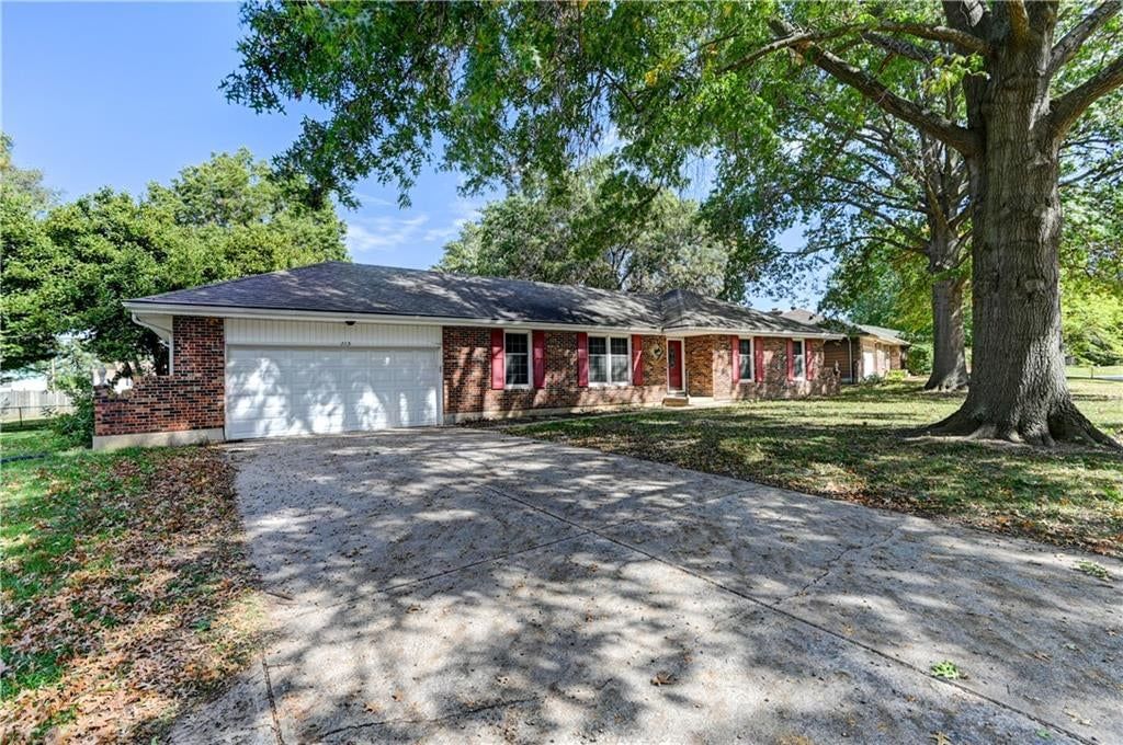 Corner lot, big backyard and fenced yard at 213 Johnson Street, Buckner, MO 64016