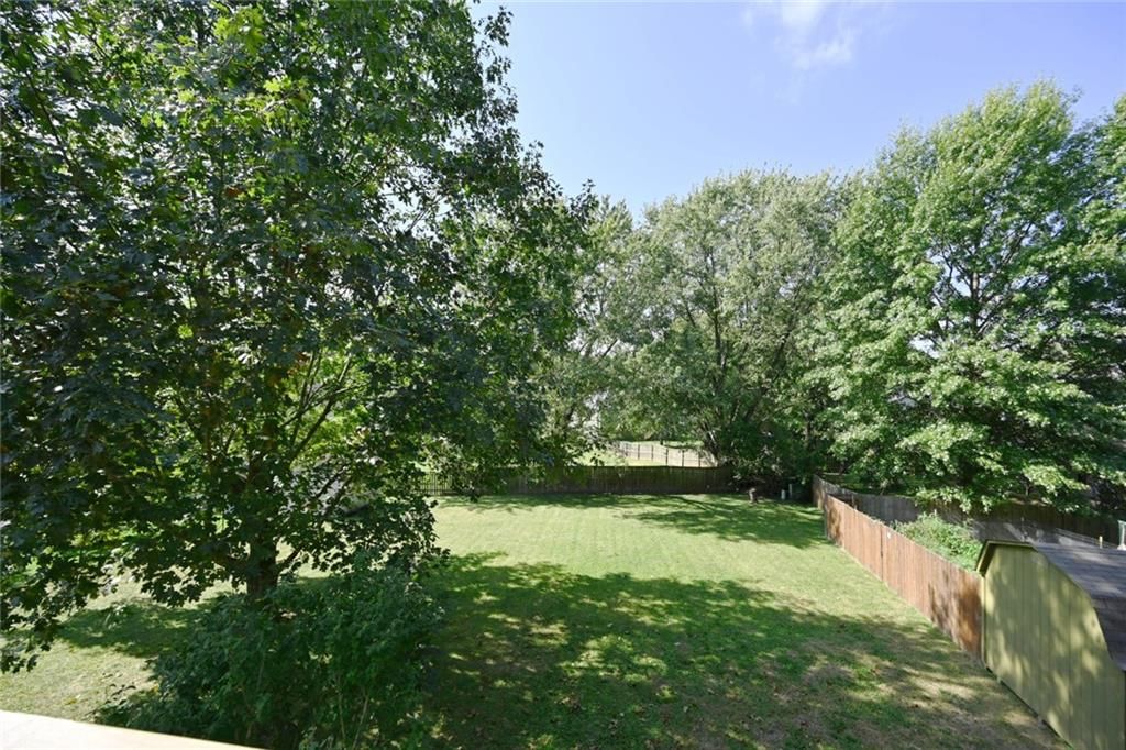 Big backyard, fenced yard and mature trees at 8516 N Winan Avenue, Kansas City, MO 64153