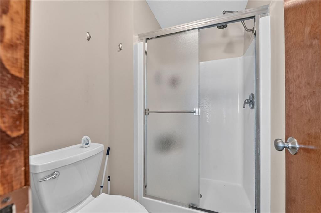 Walk-in shower and tiled shower at 2510 N 111th Terrace, Kansas City, KS 66109