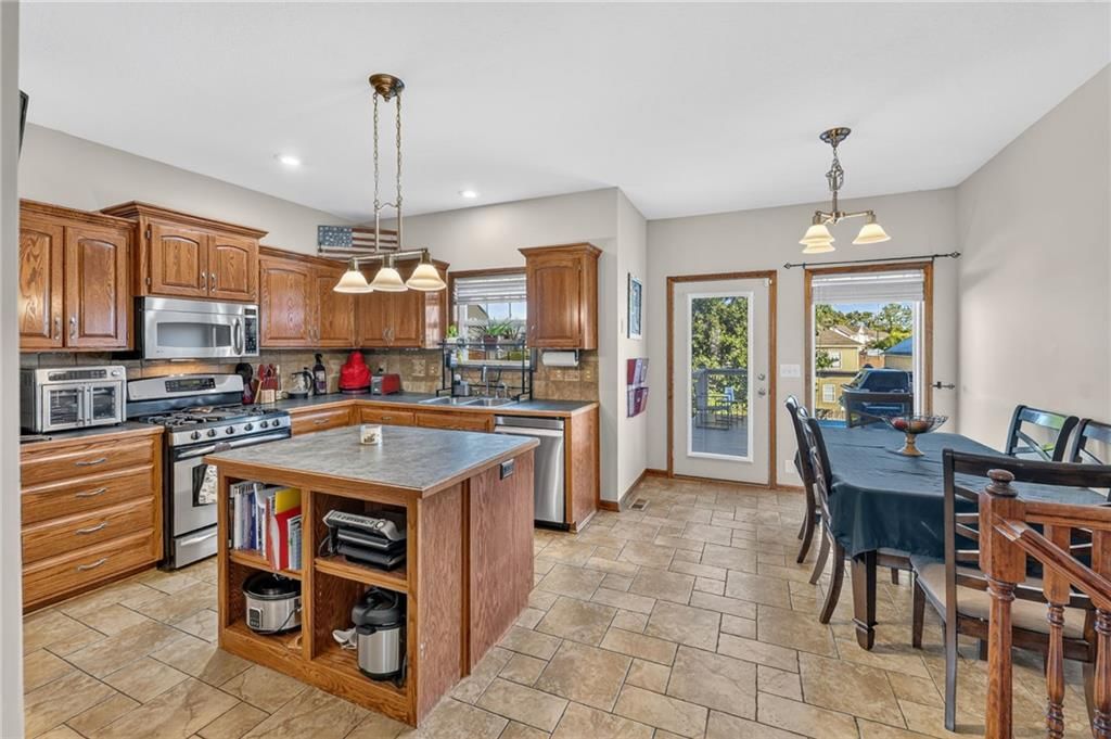 Tile floors, breakfast nook and staircase at 2510 N 111th Terrace, Kansas City, KS 66109
