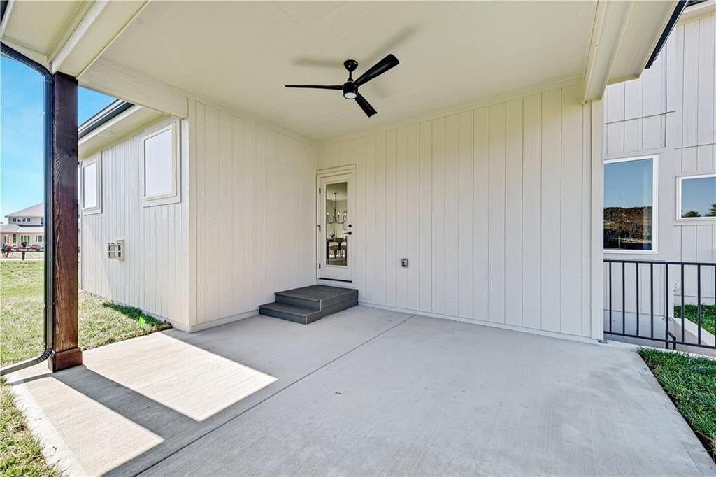 Modern, garage for three or more cars and black exterior windows at 22097 W 99th Terrace, Lenexa, KS 66220