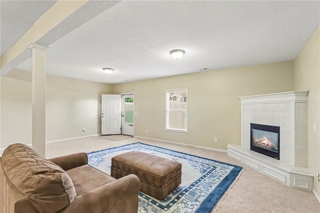 Fireplace and tile fireplace at 3213 Devonshire Drive, Platte City, MO 64079