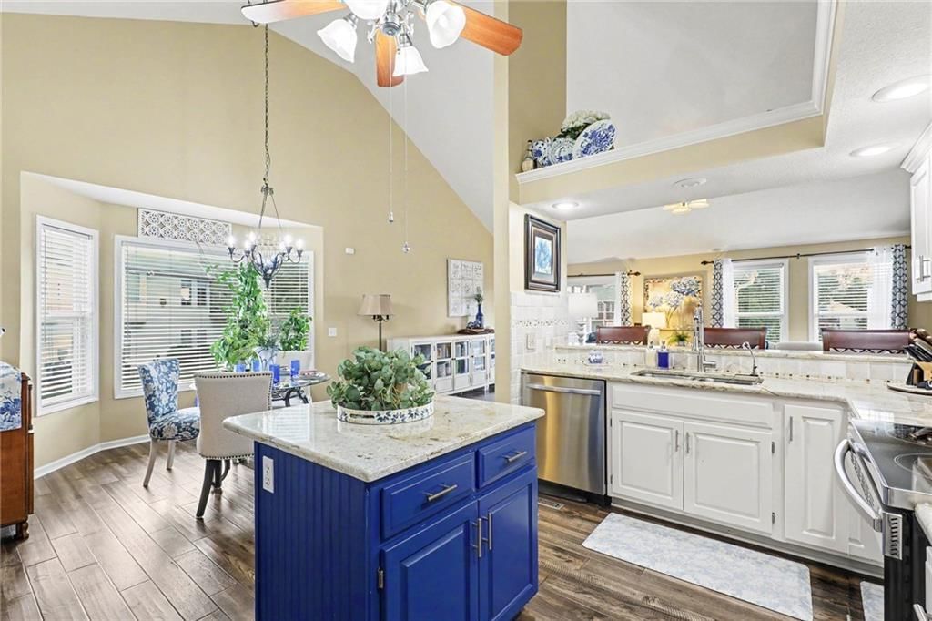 Statement lighting and breakfast nook at 3213 Devonshire Drive, Platte City, MO 64079
