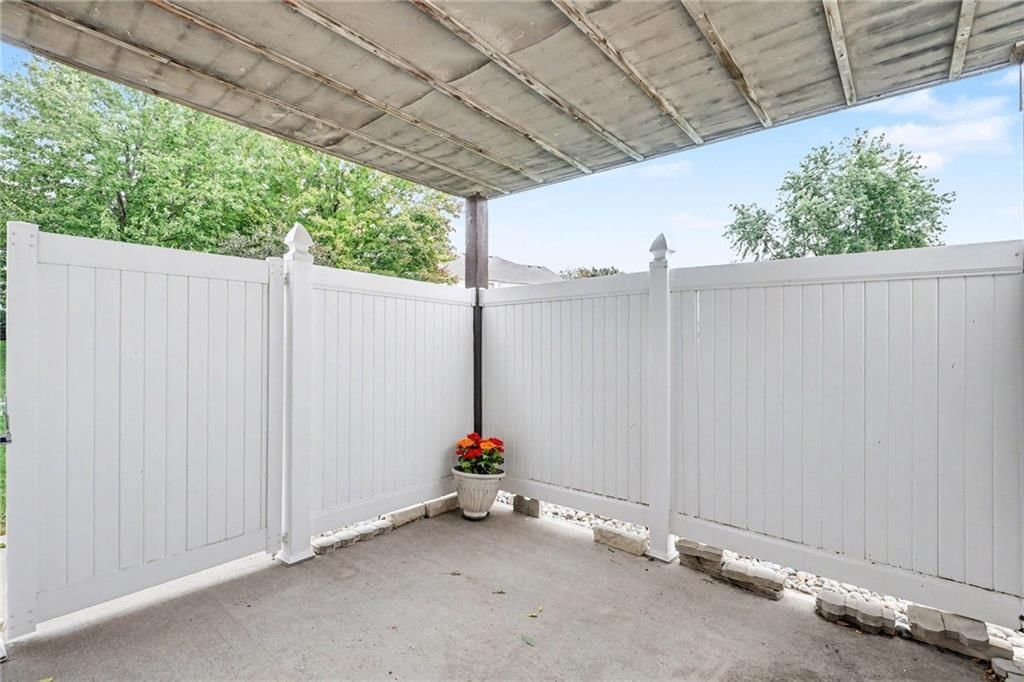 Fenced yard, vinyl fence and concrete patio at 3213 Devonshire Drive, Platte City, MO 64079