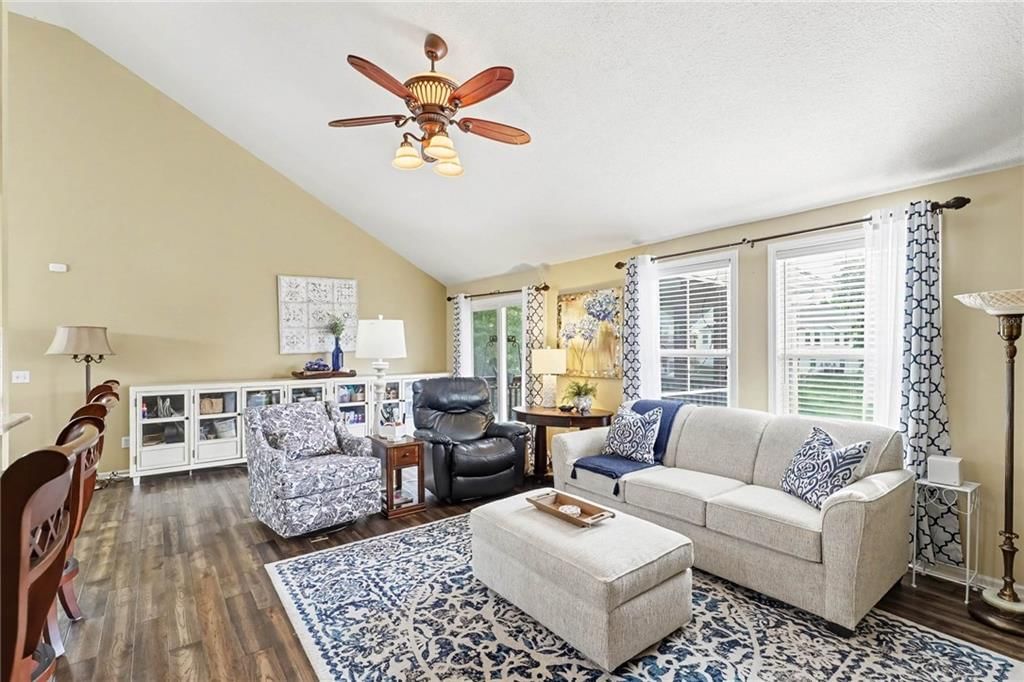 Tall ceilings, hardwood floors and wall of windows at 3213 Devonshire Drive, Platte City, MO 64079