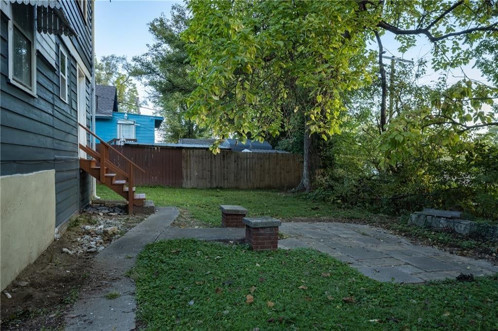 Fenced yard and concrete patio at 1951 N 28th Street, Kansas City, KS 66104