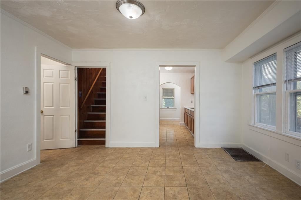 Tile floors and staircase at 1951 N 28th Street, Kansas City, KS 66104