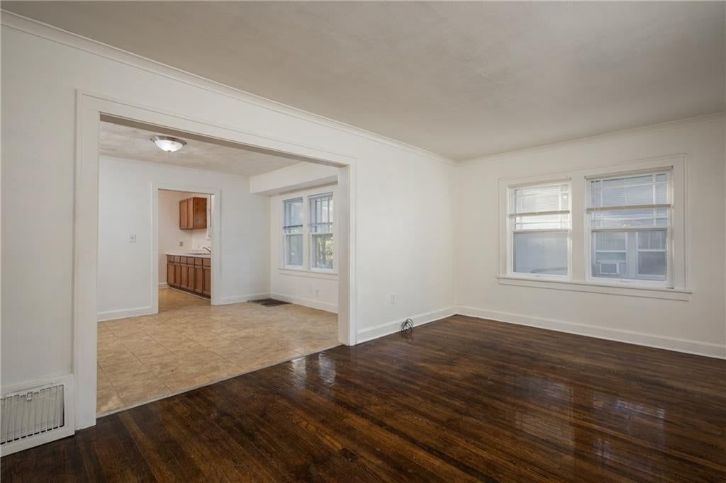 Open floor plan, hardwood floors and white trim at 1951 N 28th Street, Kansas City, KS 66104