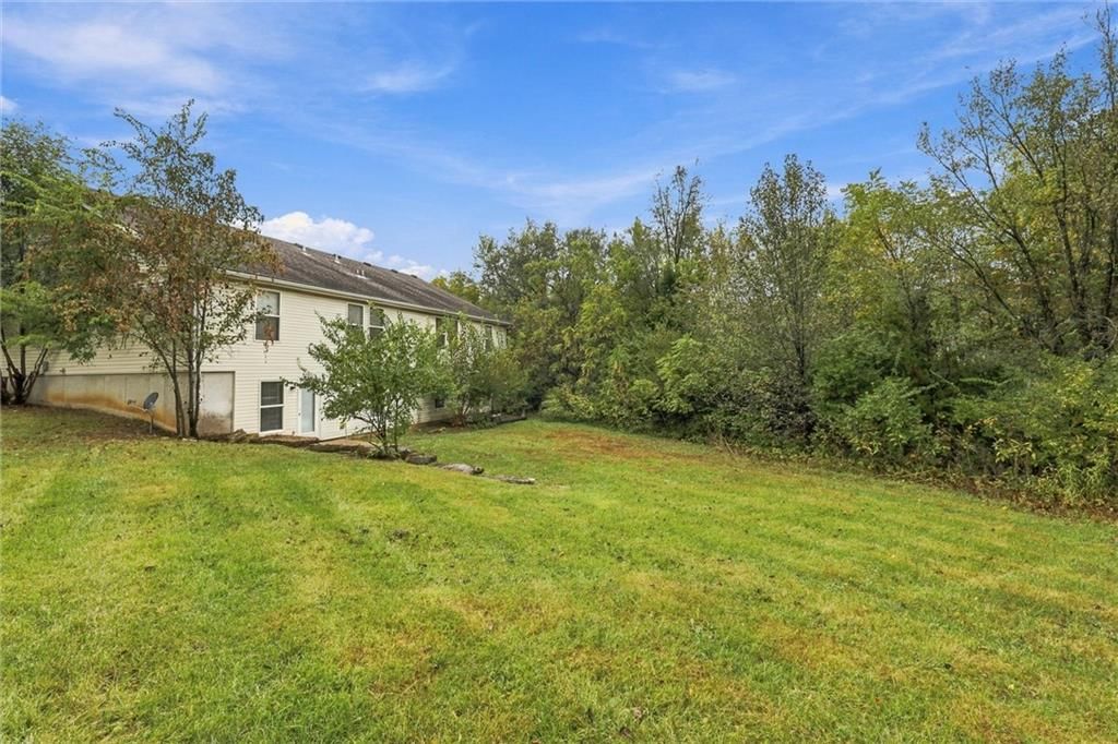 Mature trees and flat lot at 212/14 NW 27th St. Court, Blue Springs, MO 64015
