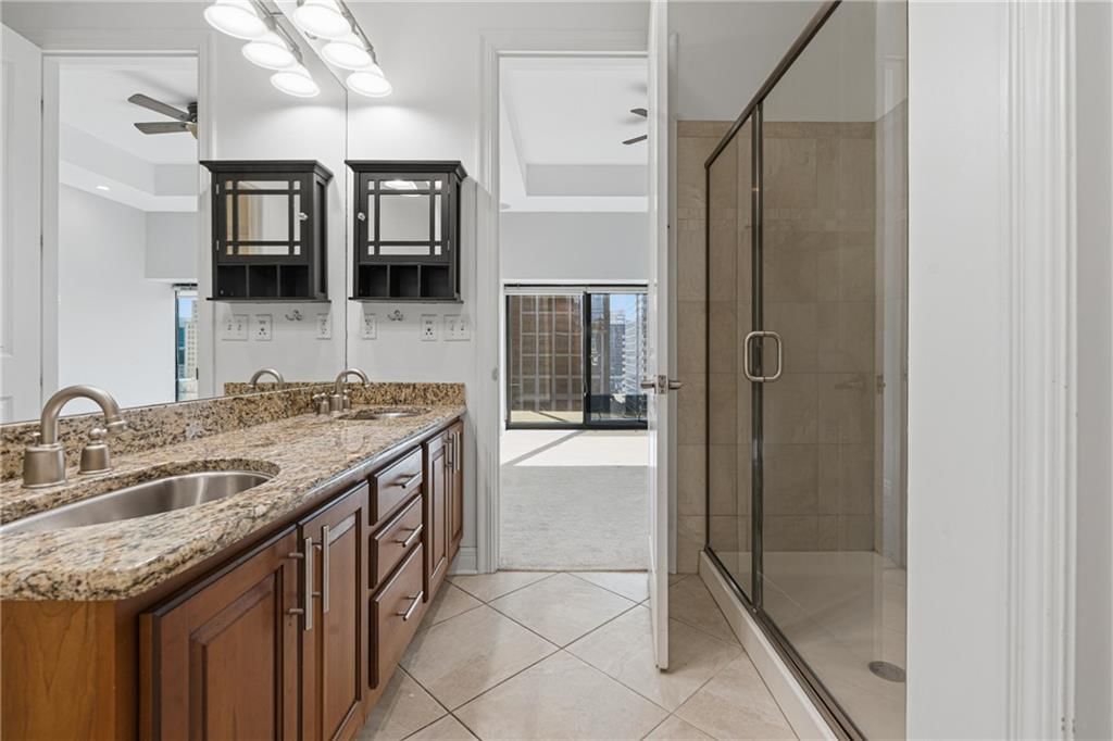 Walk-in shower and frameless glass shower at 1101 Walnut Street #907, Kansas City, MO 64106